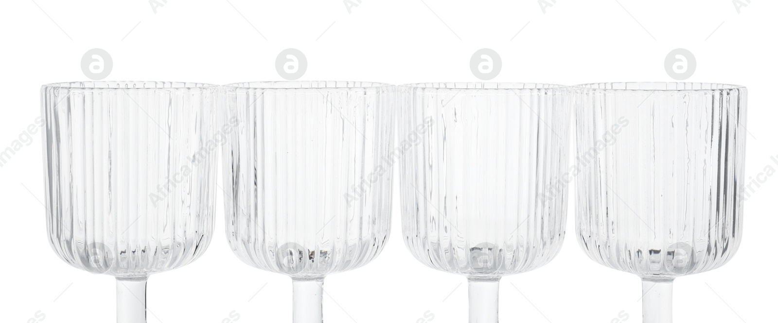 Photo of Many empty clean glasses isolated on white