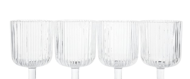 Photo of Many empty clean glasses isolated on white