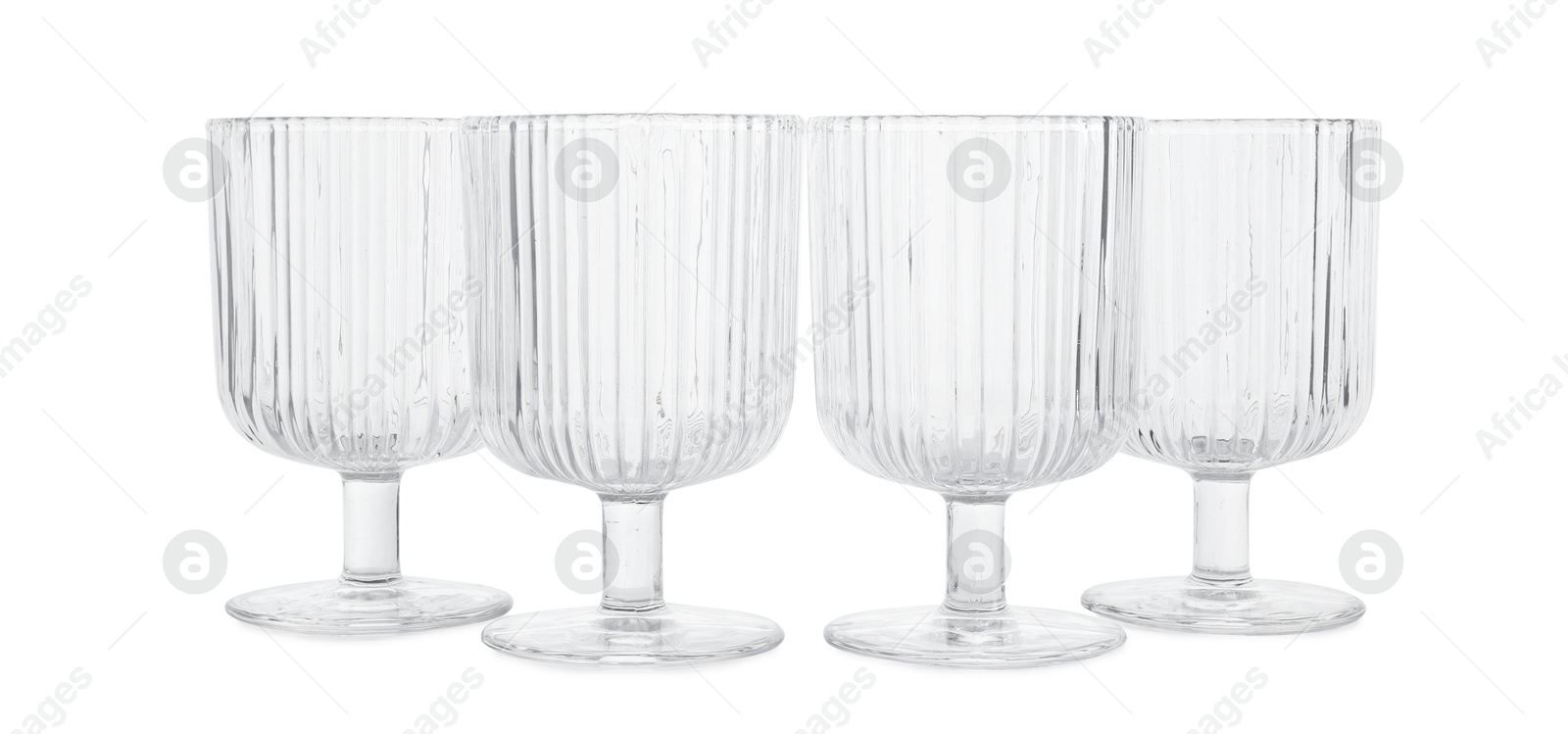 Photo of Many empty clean glasses isolated on white