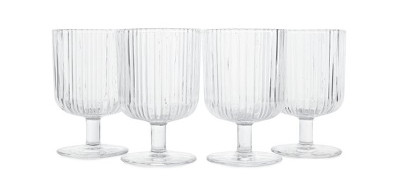 Photo of Many empty clean glasses isolated on white