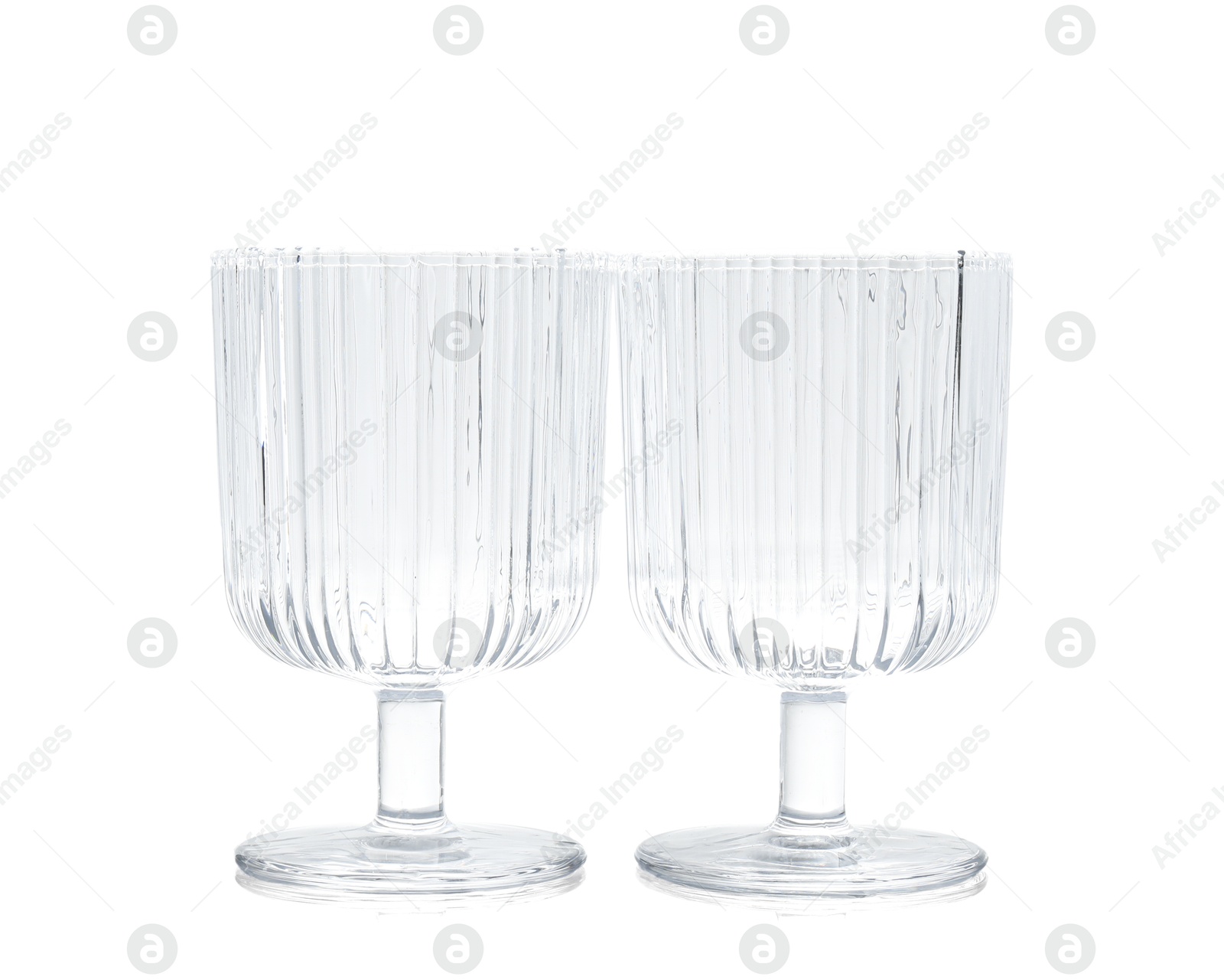 Photo of Two empty clean glasses isolated on white