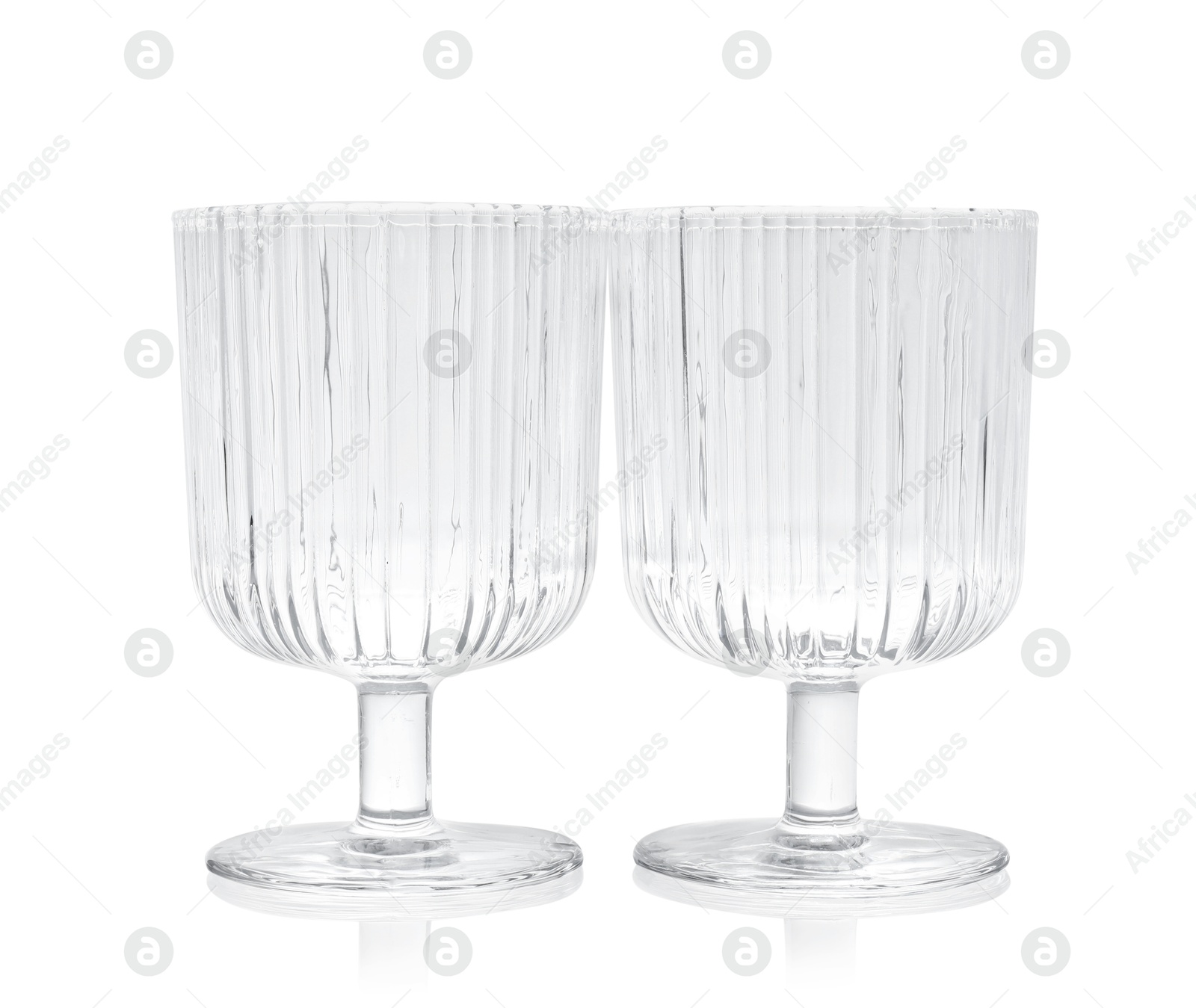 Photo of Two empty clean glasses isolated on white