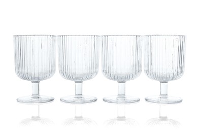 Photo of Many empty clean glasses isolated on white