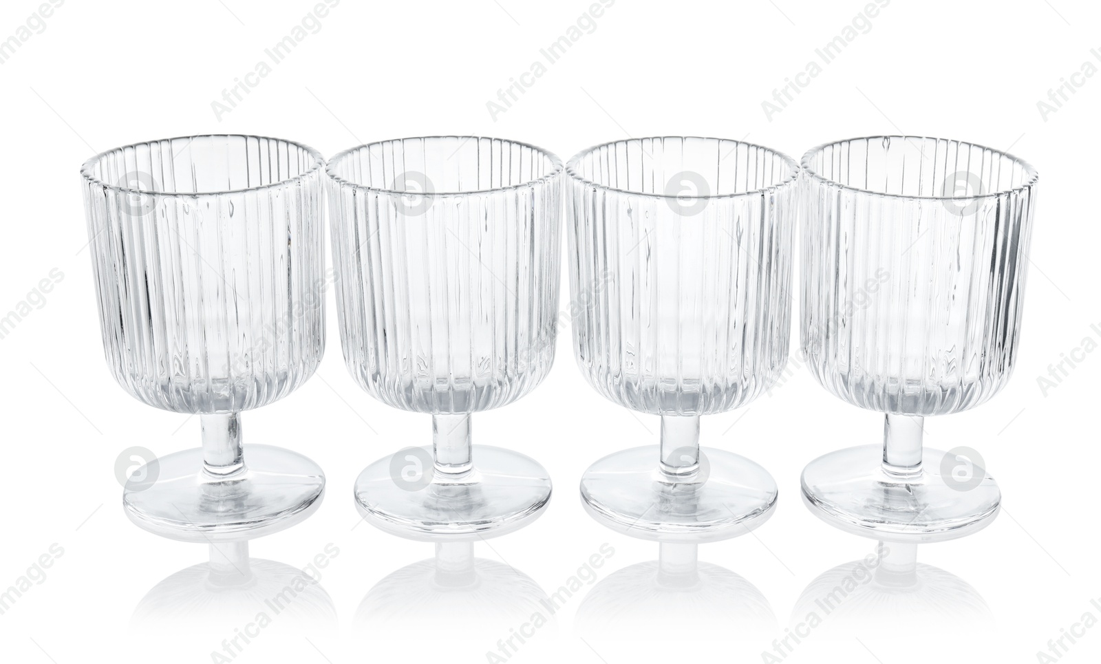 Photo of Many empty clean glasses isolated on white