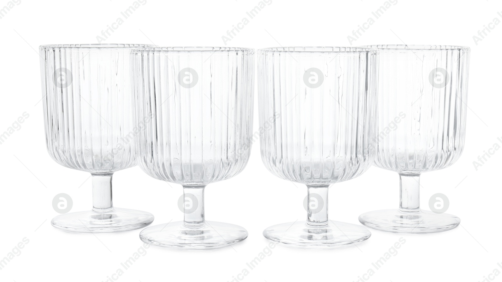 Photo of Many empty clean glasses isolated on white