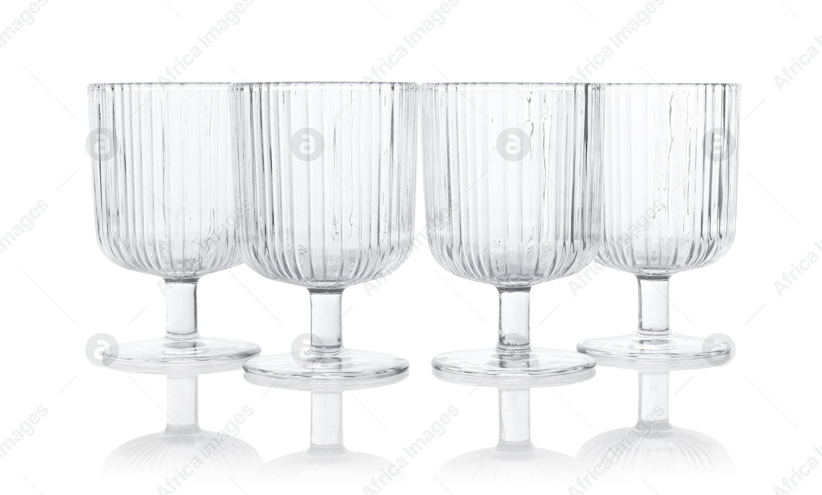 Photo of Many empty clean glasses isolated on white