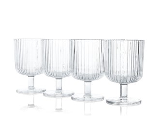 Photo of Many empty clean glasses isolated on white