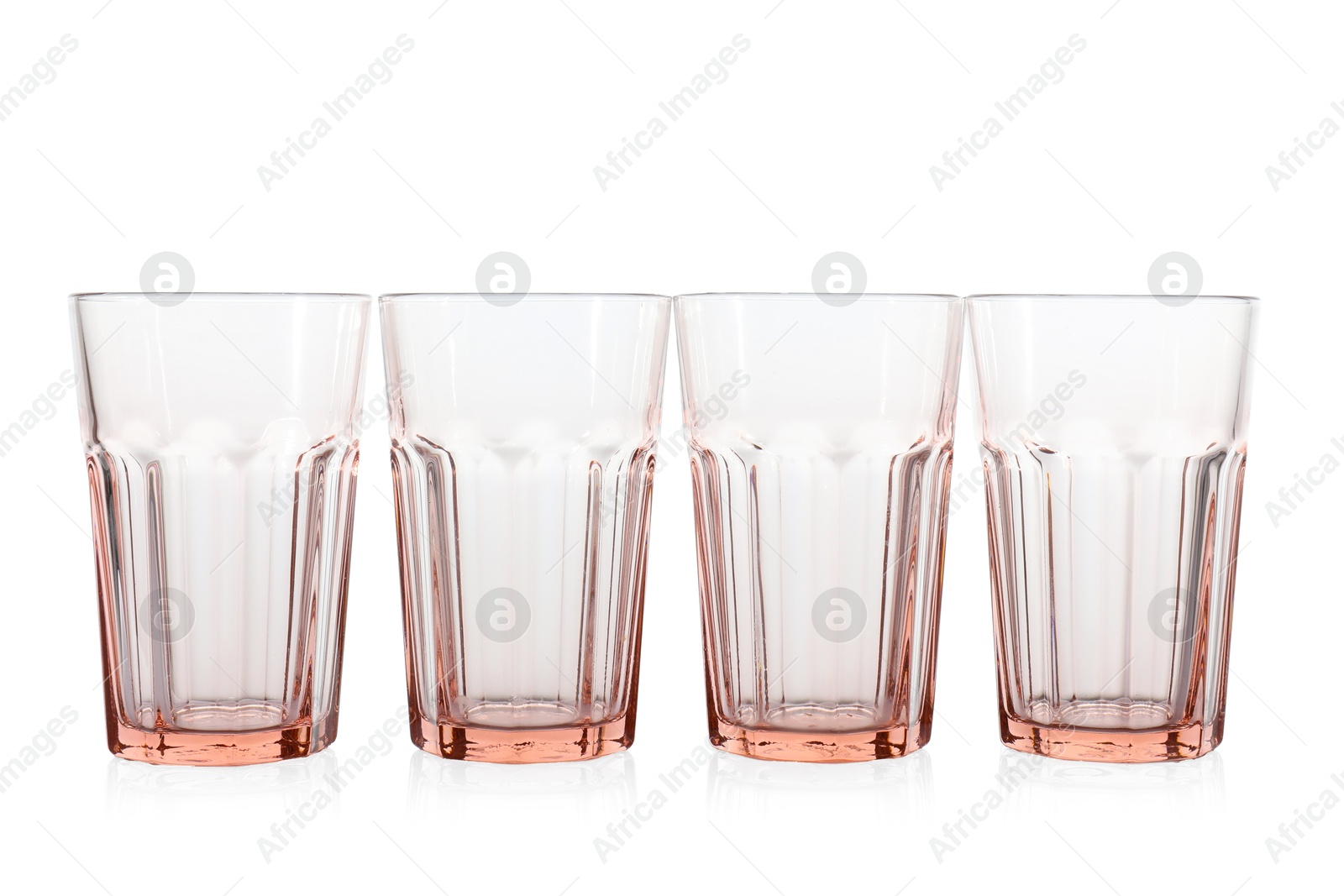 Photo of Many empty clean glasses isolated on white