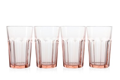 Photo of Many empty clean glasses isolated on white