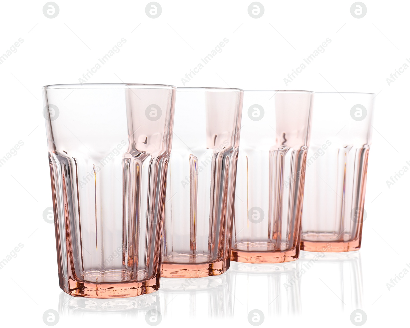 Photo of Many empty clean glasses isolated on white