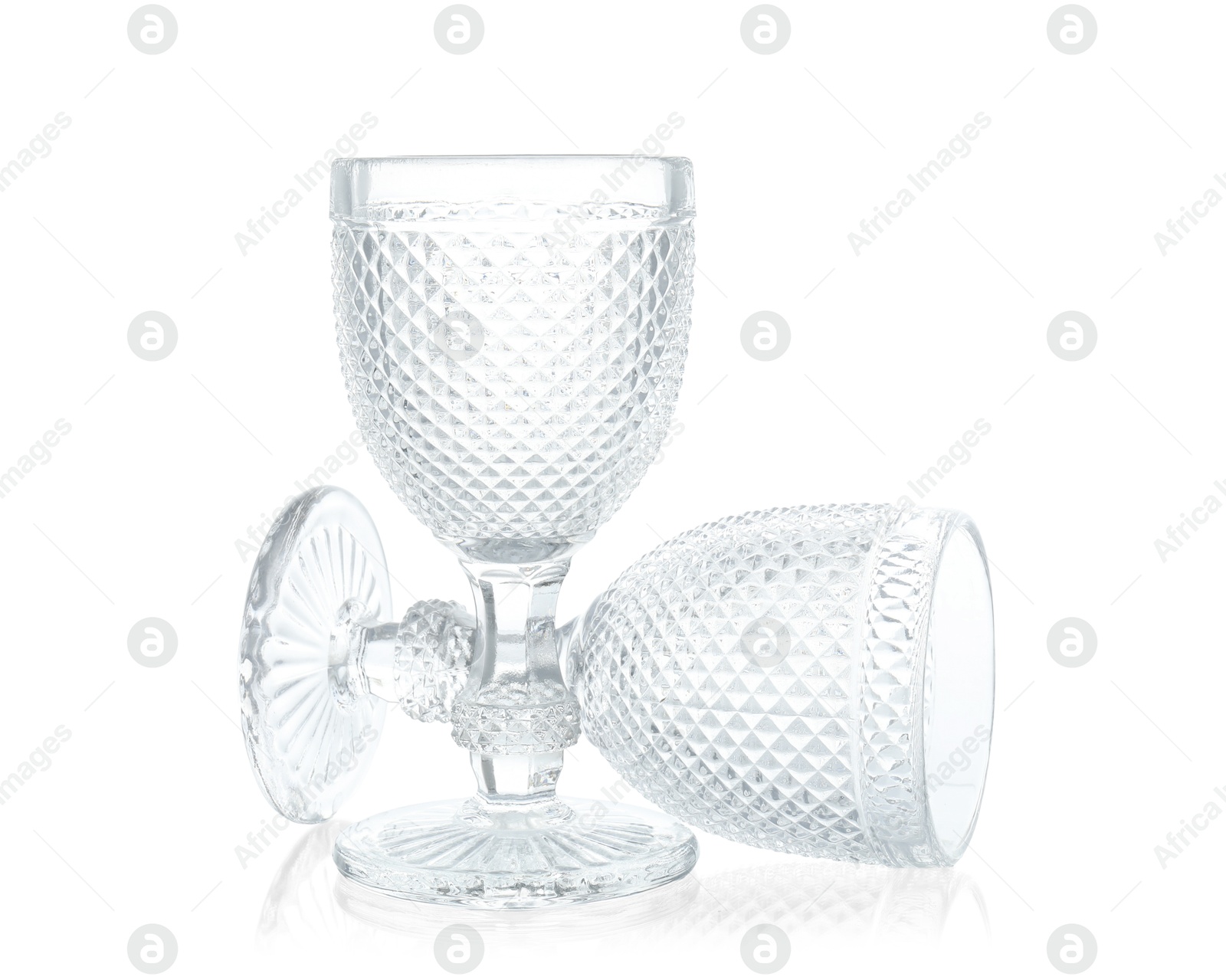 Photo of Two empty clean glasses isolated on white