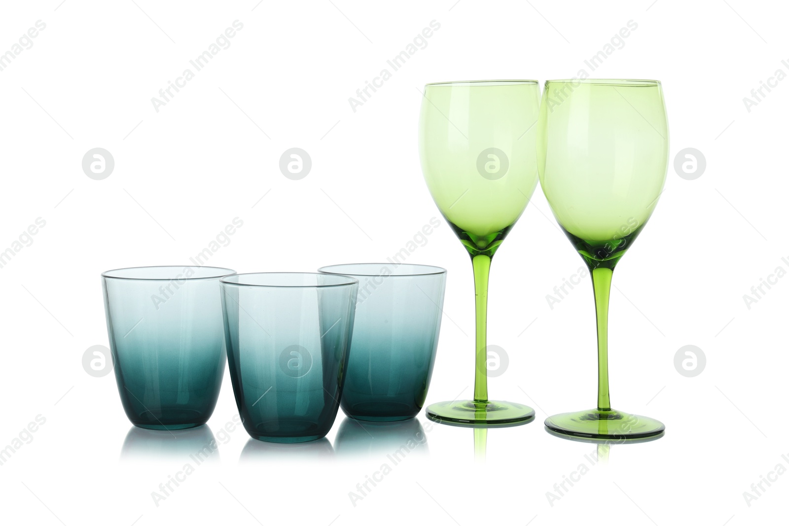 Photo of Many empty clean glasses isolated on white