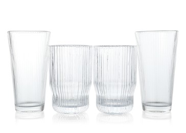 Photo of Many empty clean glasses isolated on white