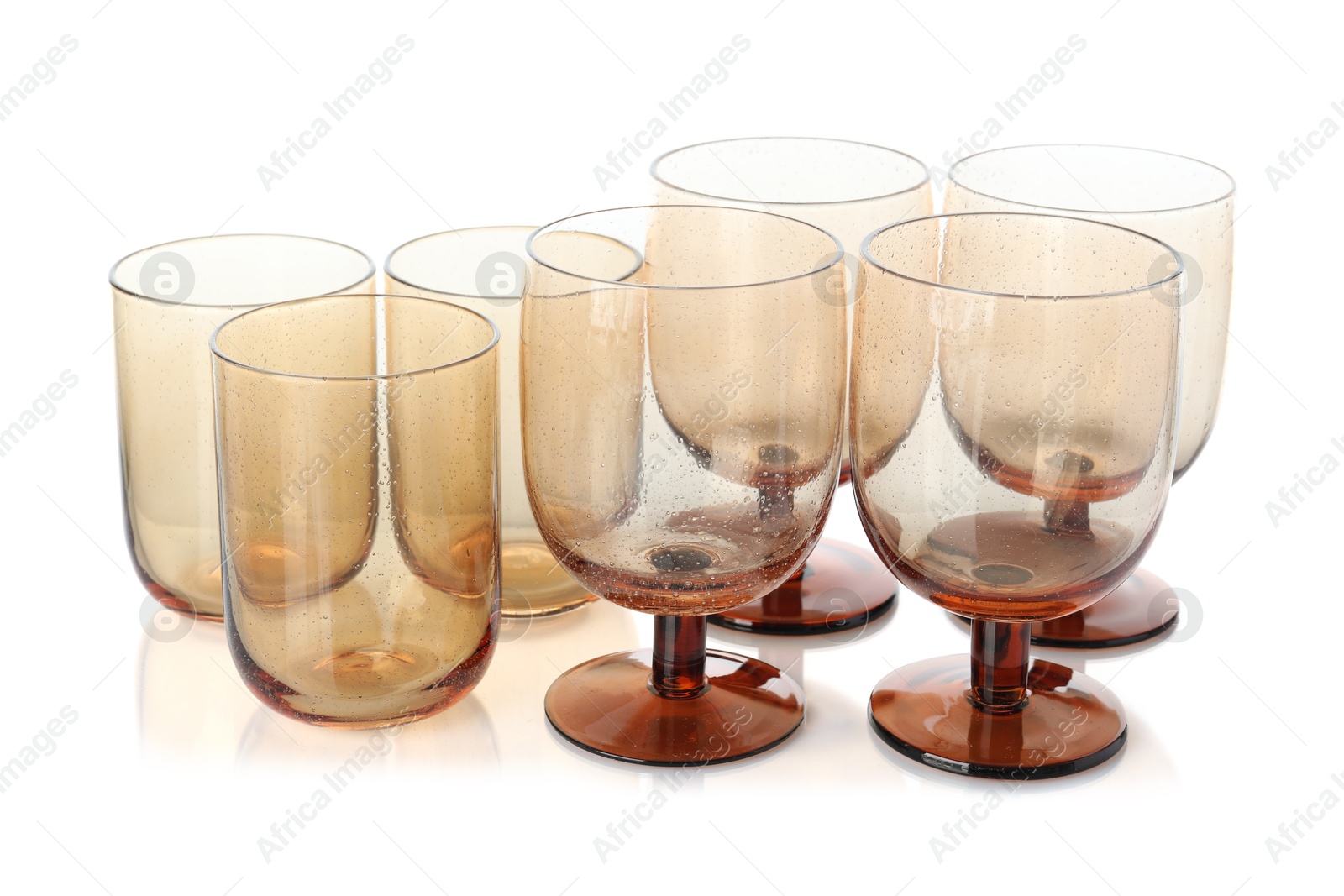 Photo of Many empty clean glasses isolated on white