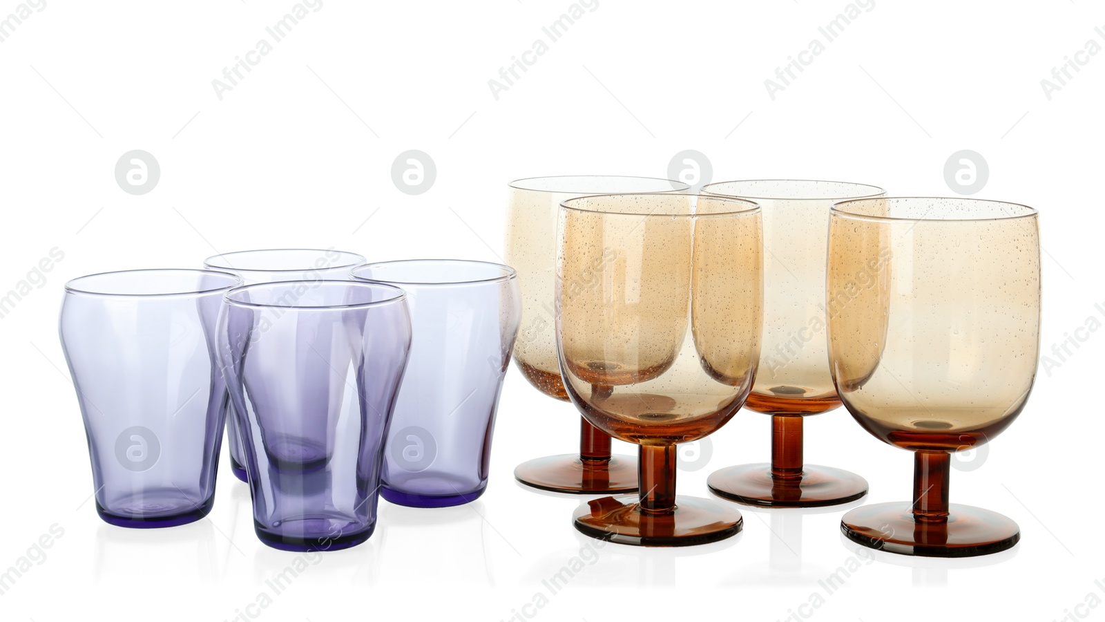 Photo of Many empty clean glasses isolated on white