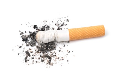 Photo of One cigarette butt isolated on white. Smoking habit