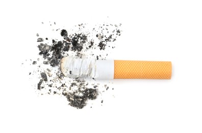 Photo of One cigarette butt isolated on white, top view. Smoking habit