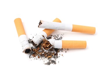 Photo of Cigarette butts isolated on white. Smoking habit