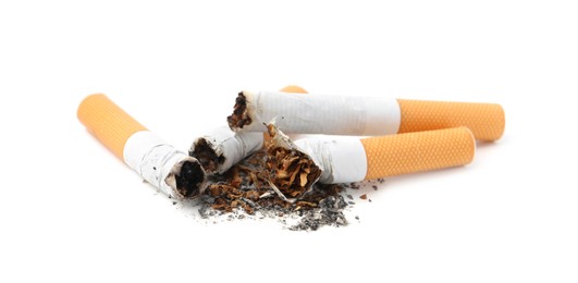 Photo of Cigarette butts isolated on white. Smoking habit