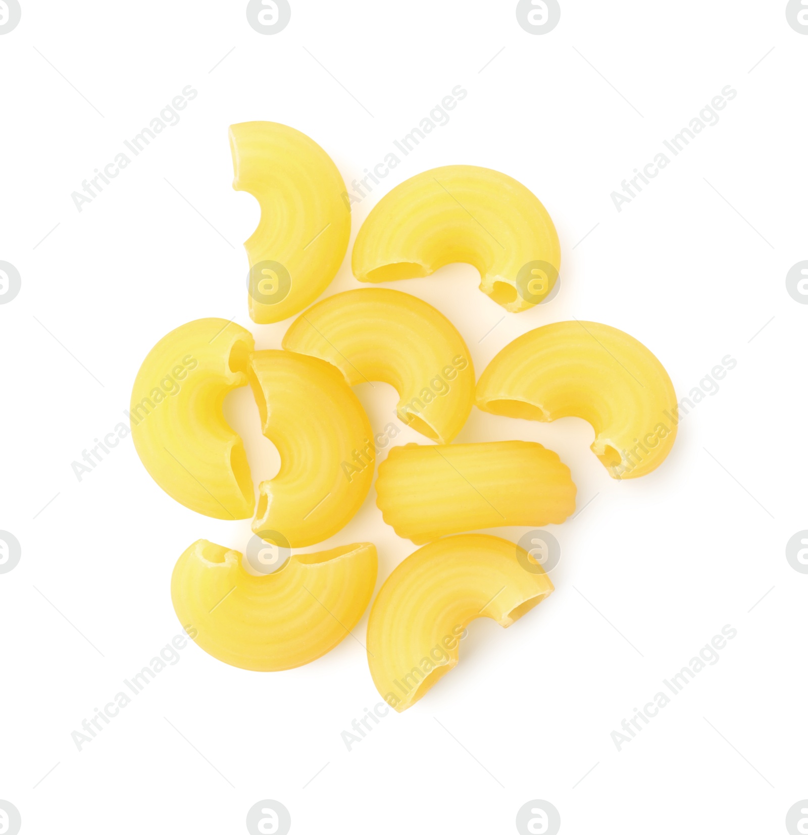 Photo of Pile of raw horns pasta isolated on white, top view