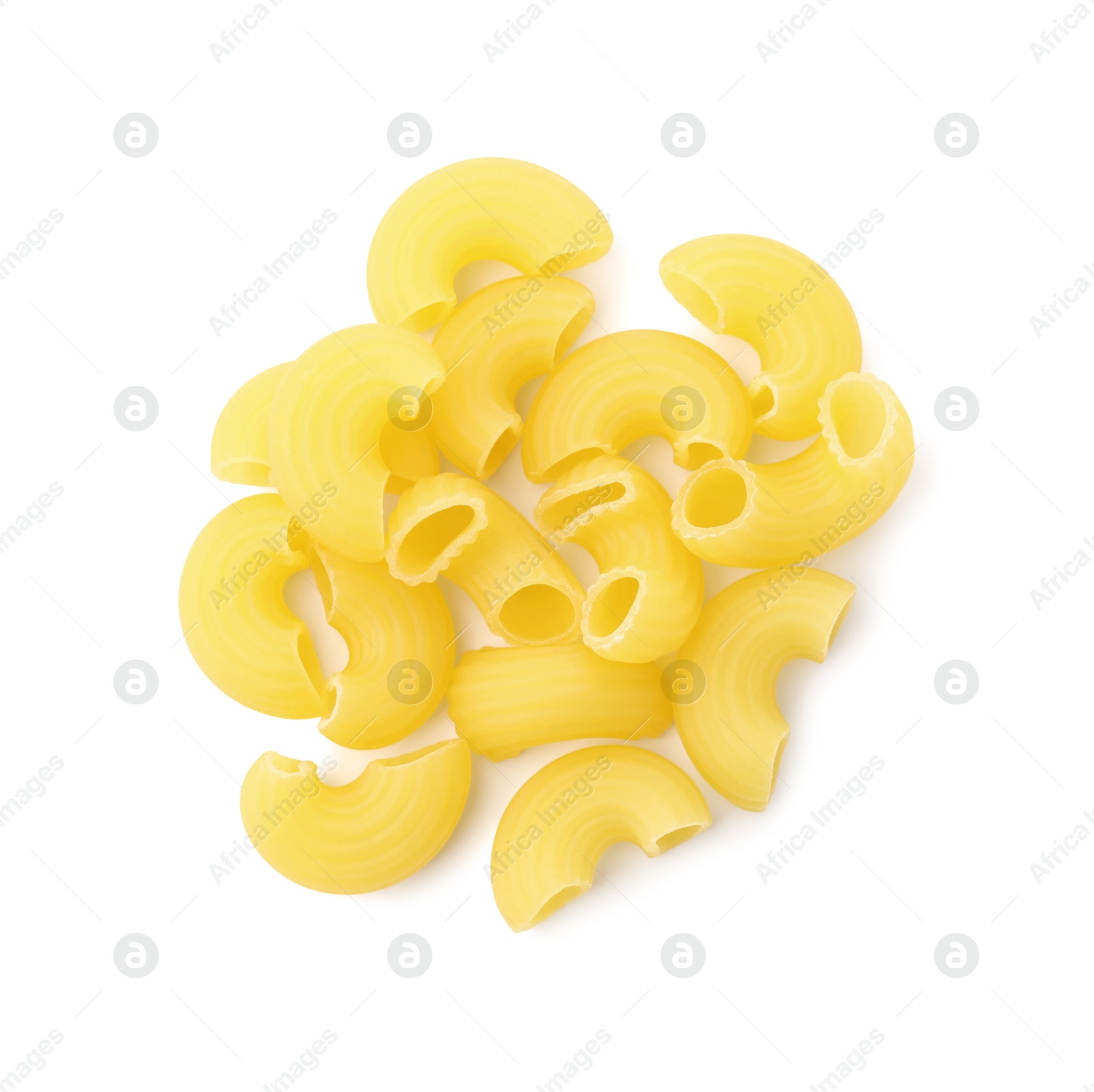 Photo of Pile of raw horns pasta isolated on white, top view