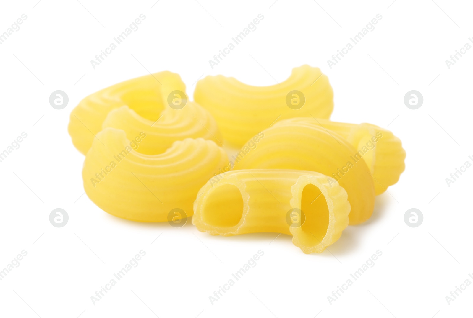 Photo of Pile of raw horns pasta isolated on white