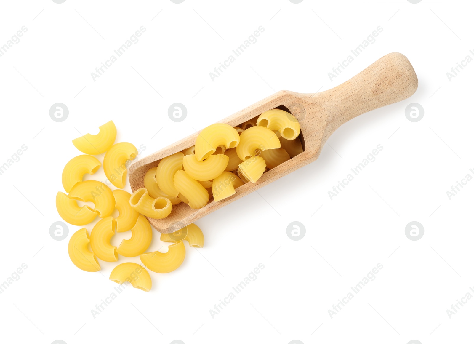 Photo of Raw horns pasta in scoop isolated on white, top view