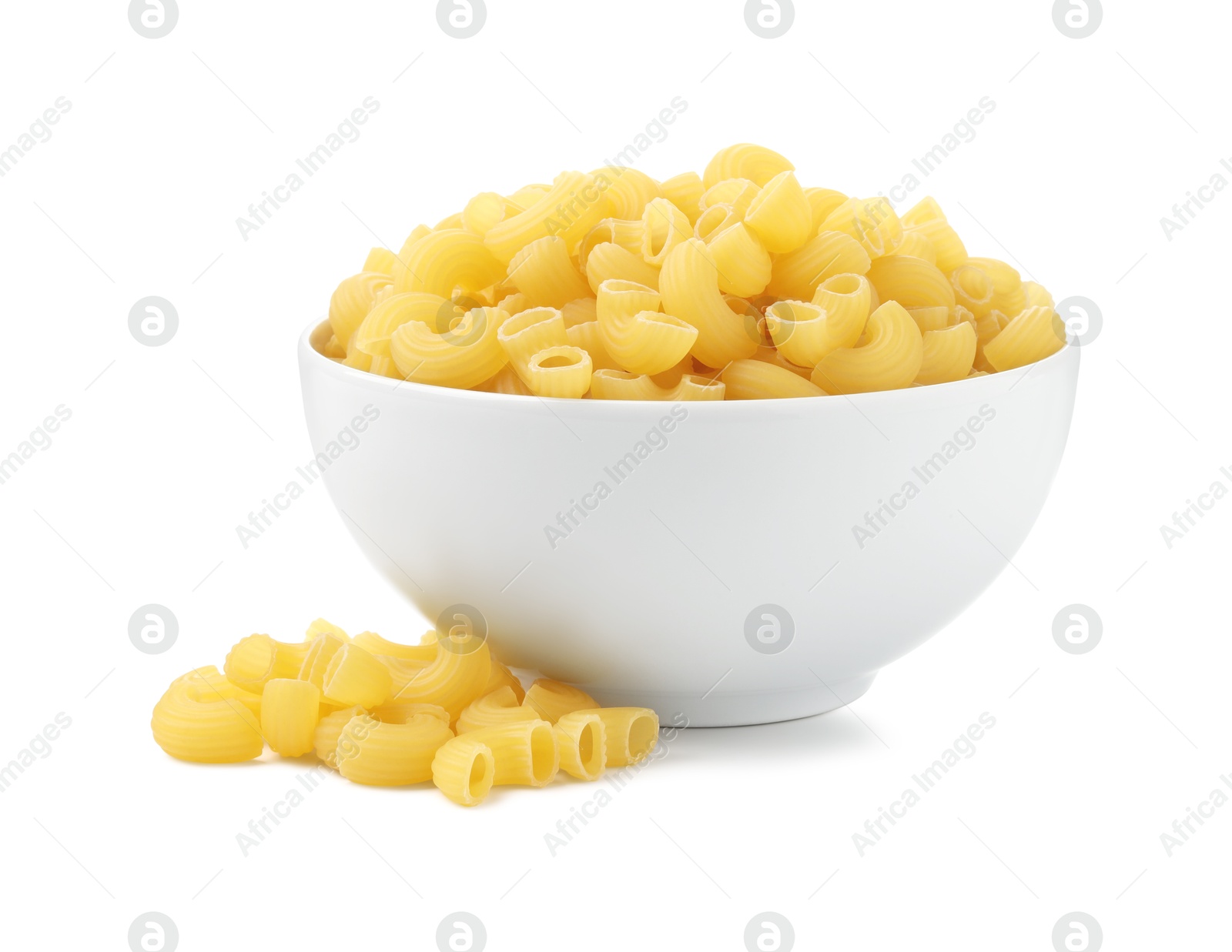 Photo of Raw horns pasta in bowl isolated on white