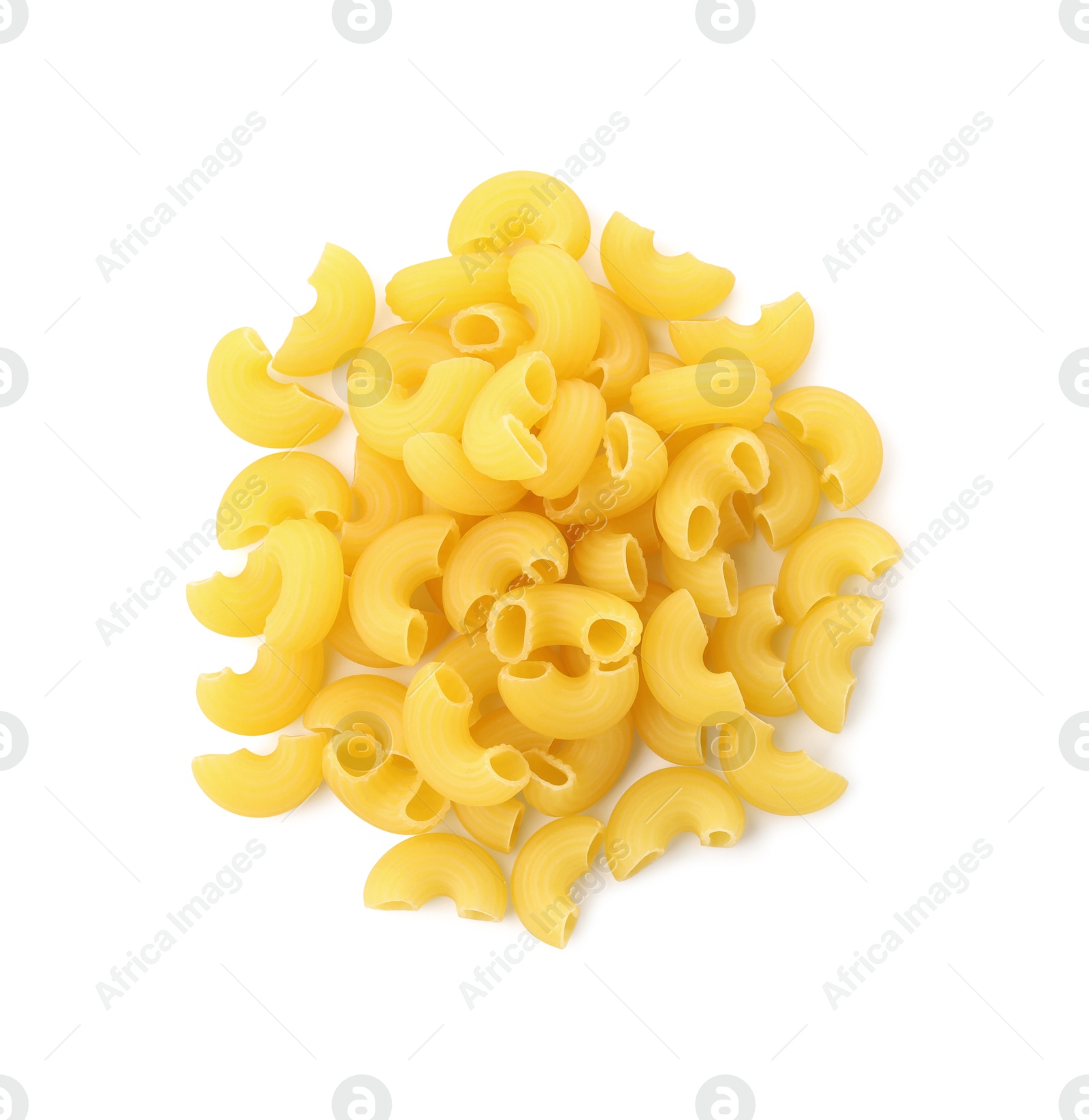 Photo of Pile of raw horns pasta isolated on white, top view