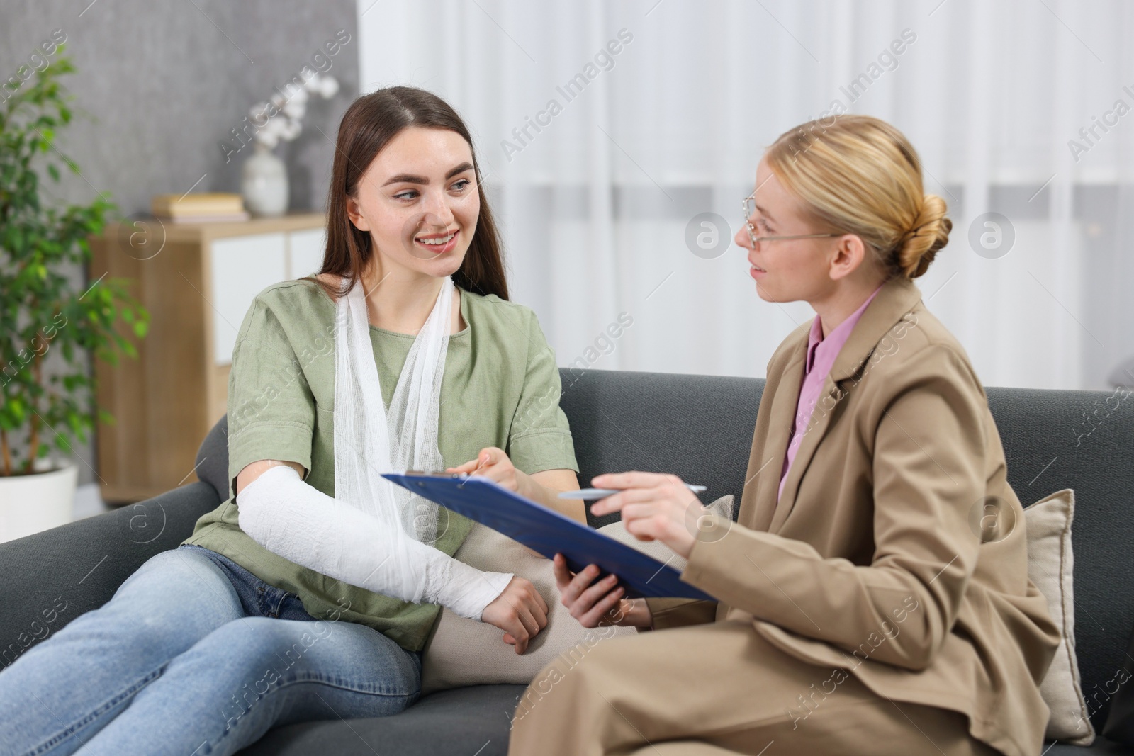 Photo of Injured woman having meeting with lawyer in office