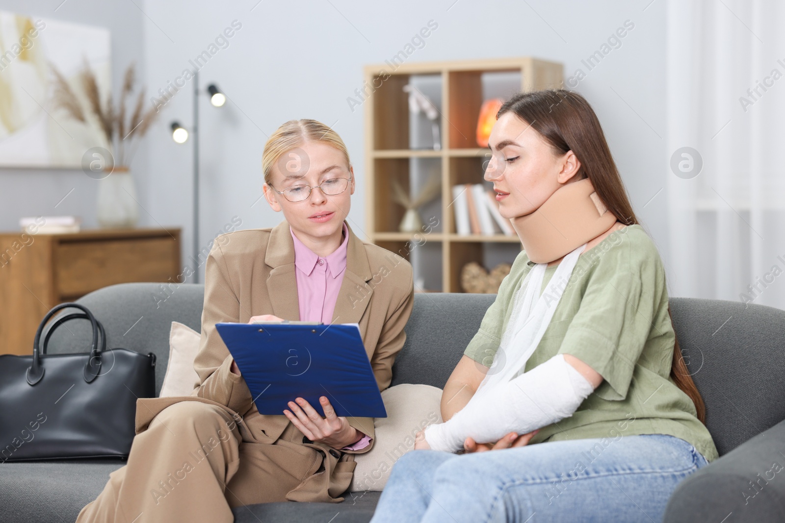 Photo of Injured woman having meeting with lawyer in office