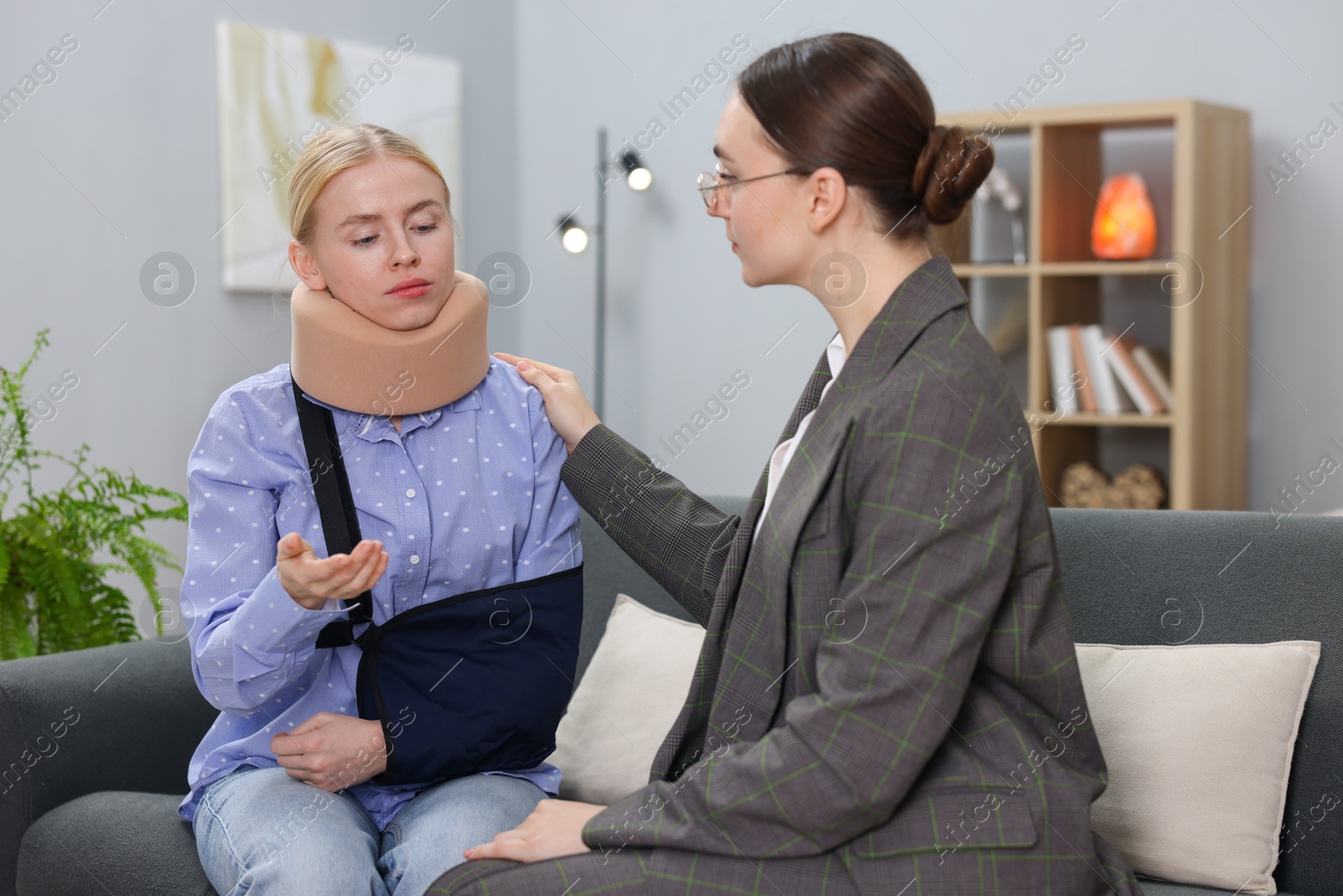 Photo of Injured woman having meeting with lawyer in office