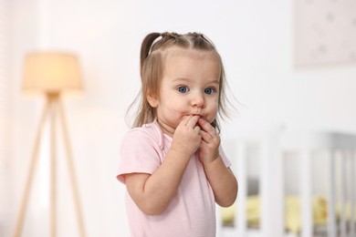 Photo of Portrait of cute little girl at home