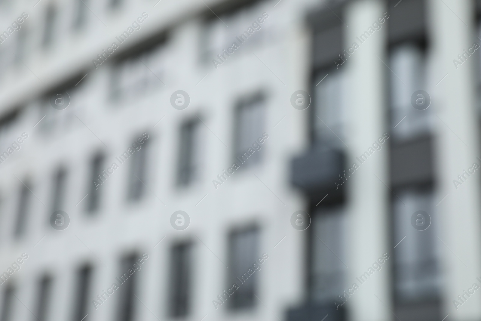 Photo of Blurred view of modern building with many windows outdoors