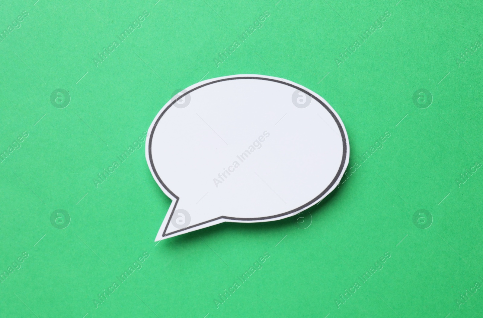 Photo of Blank speech bubble on green background. Space for text