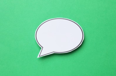 Photo of Blank speech bubble on green background. Space for text