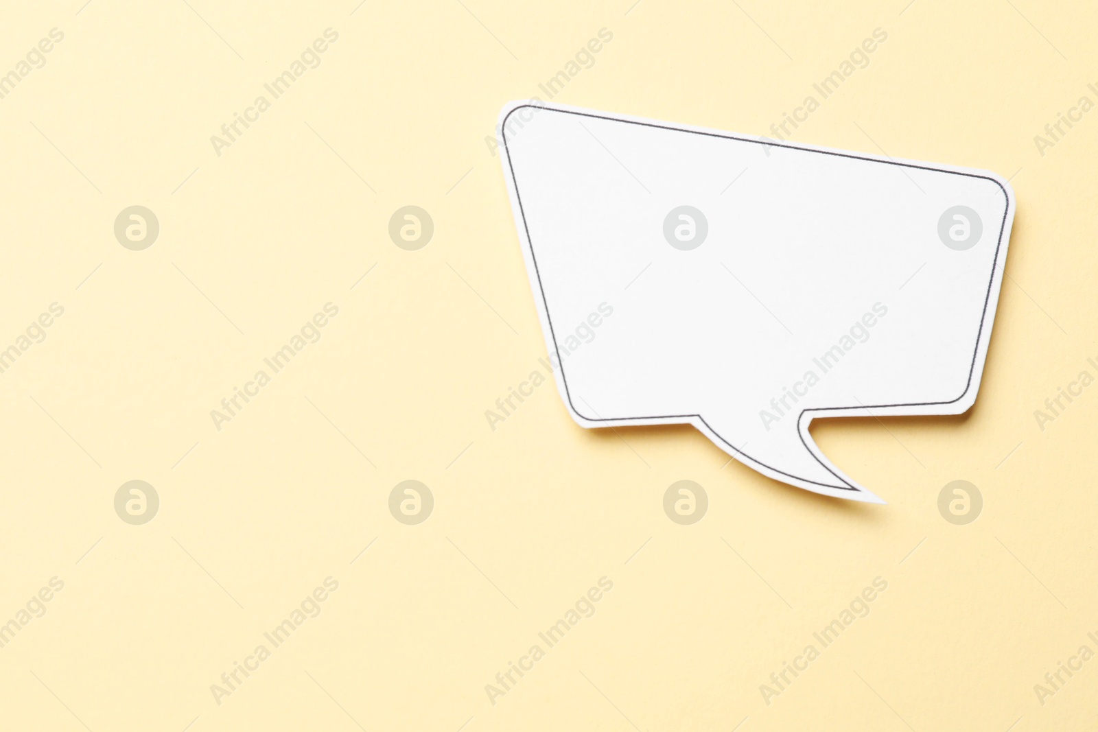 Photo of Blank speech bubble on beige background, top view. Space for text