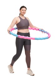 Photo of Plus size woman in gym clothes with hula hoop on white background