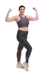 Photo of Plus size woman in gym clothes on white background