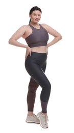 Photo of Plus size woman in gym clothes on white background