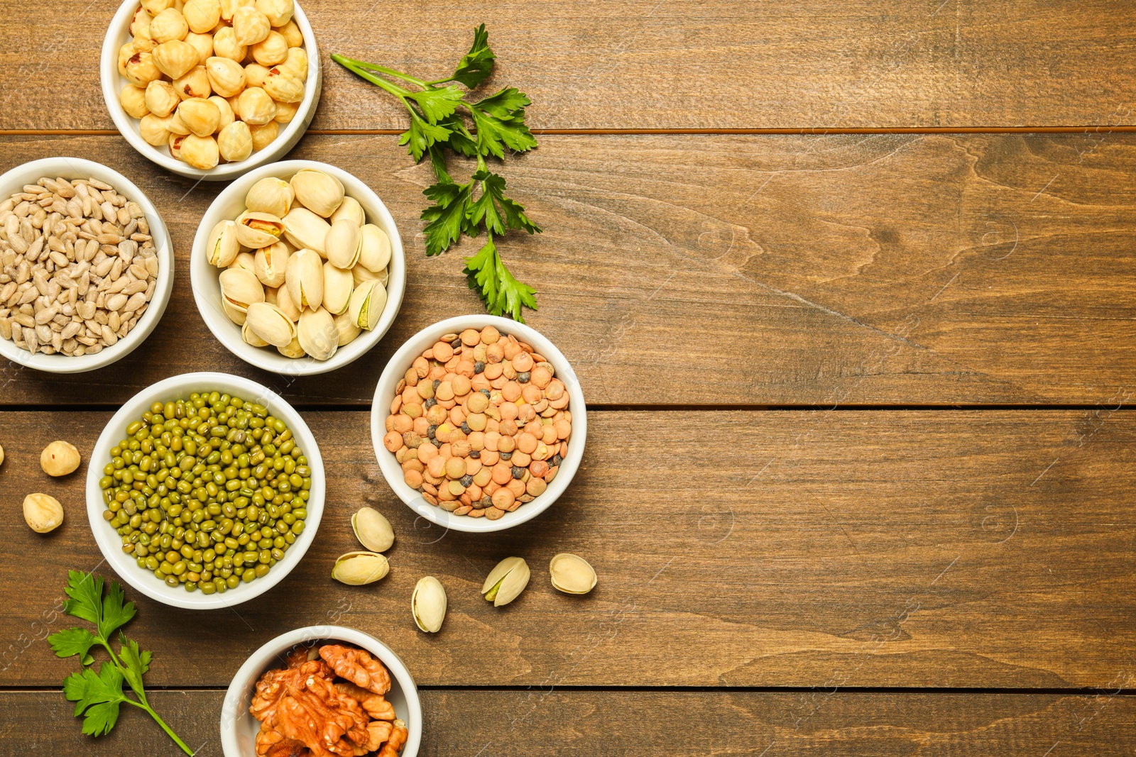 Photo of Superfood. Different healthy food products on wooden table, flat lay. Space for text