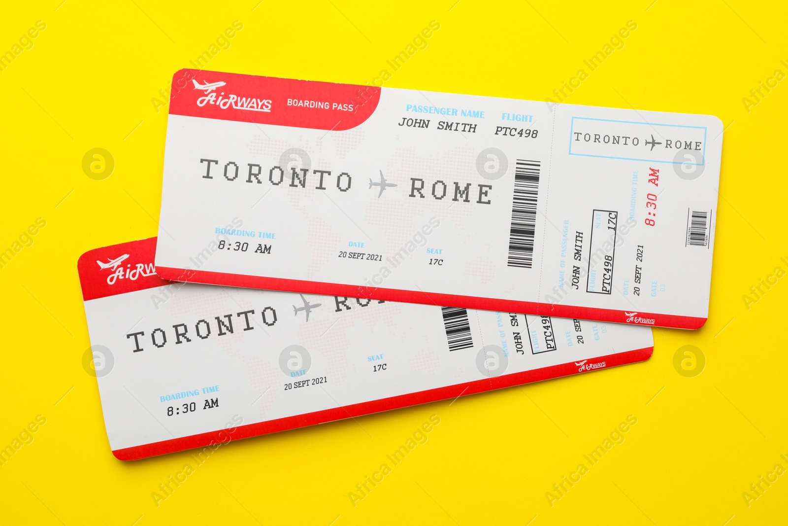 Photo of Travel agency. Flight tickets on yellow background, top view