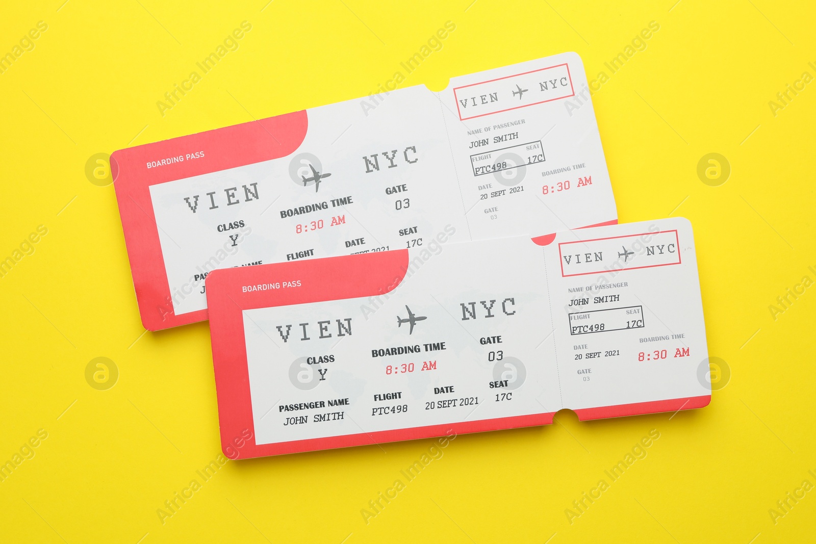 Photo of Travel agency. Flight tickets on yellow background, top view