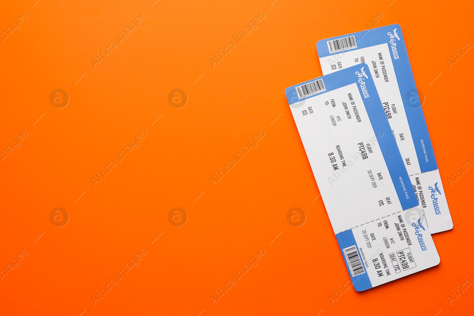 Photo of Travel agency. Flight tickets on orange background, top view. Space for text