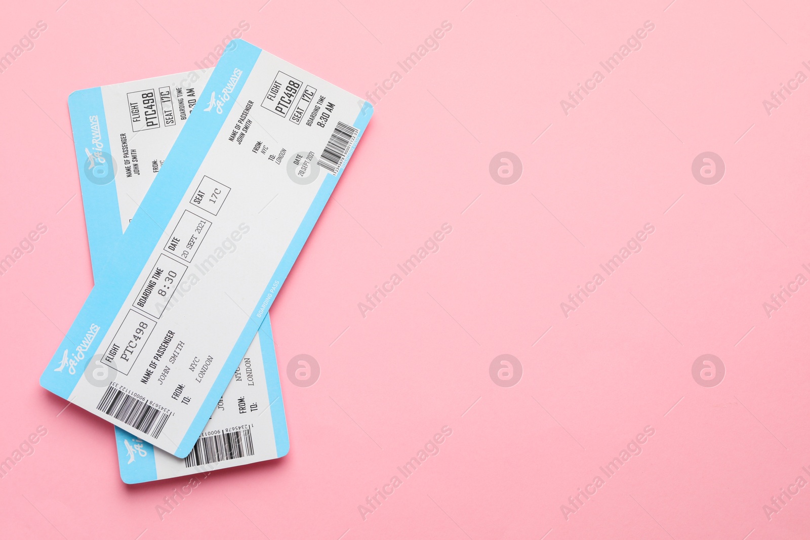 Photo of Travel agency. Flight tickets on pink background, top view. Space for text