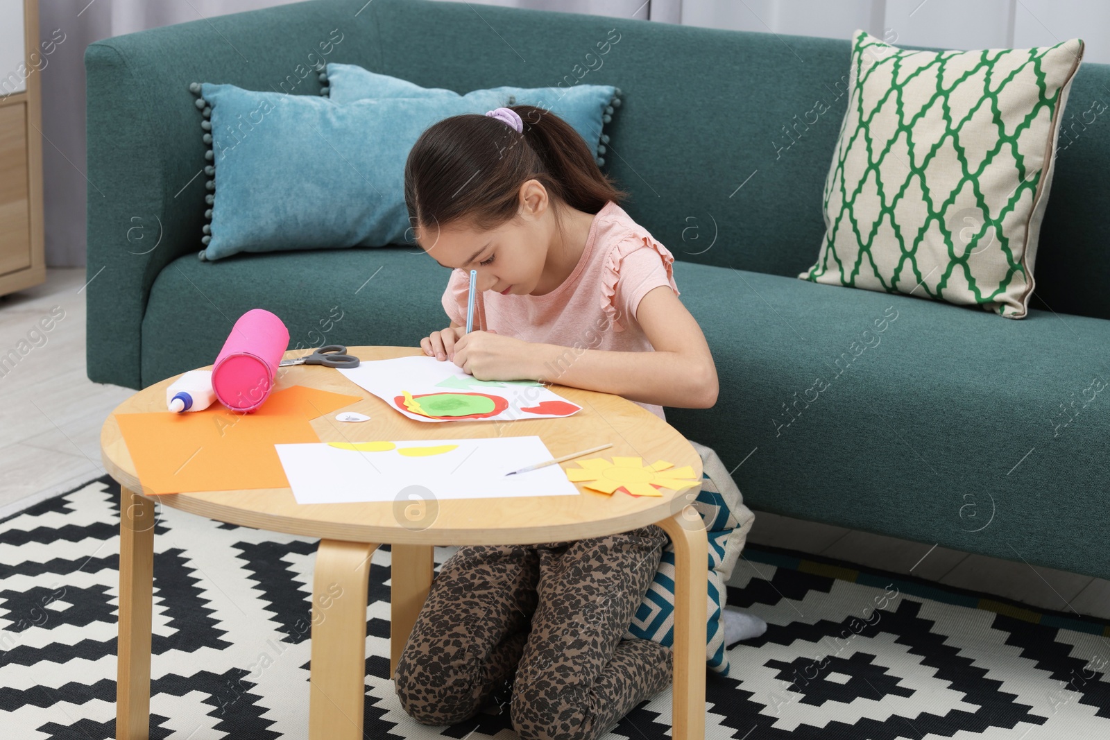 Photo of Girl drawing card at table indoors. Art and craft