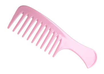 Photo of One pink plastic comb isolated on white