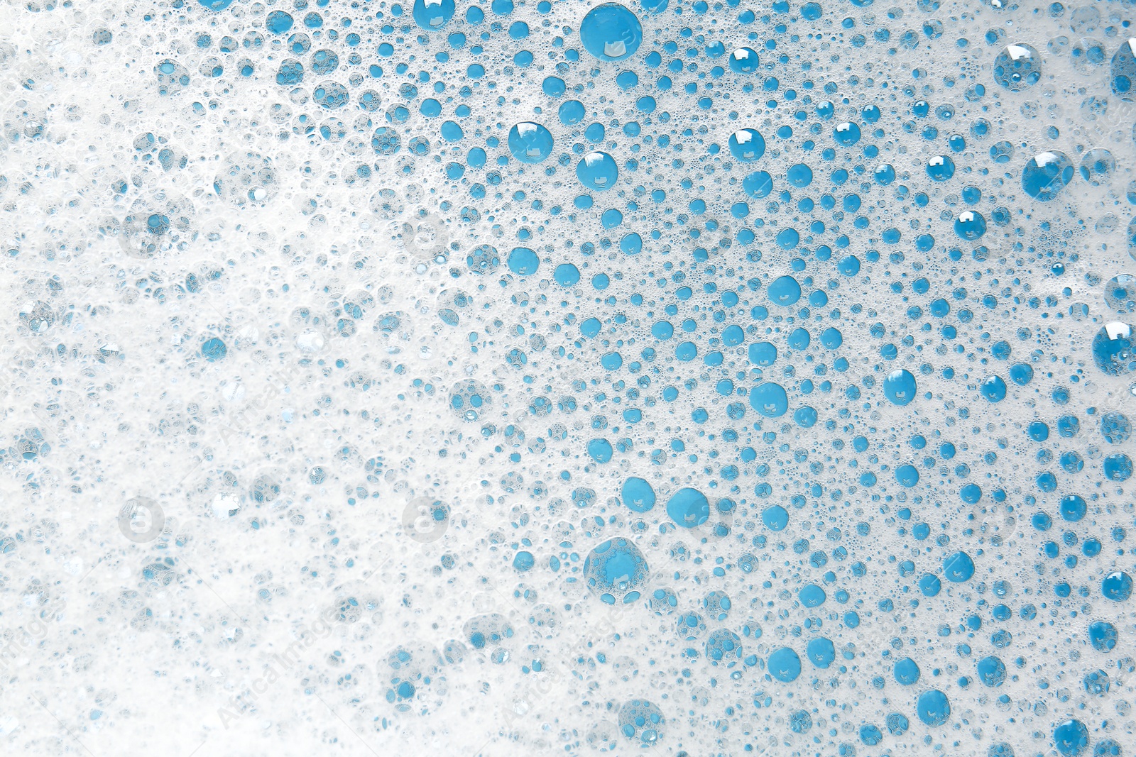 Photo of Detergent foam with bubbles as background, top view