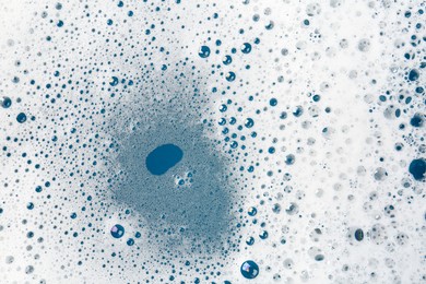 Photo of Detergent foam with bubbles as background, top view