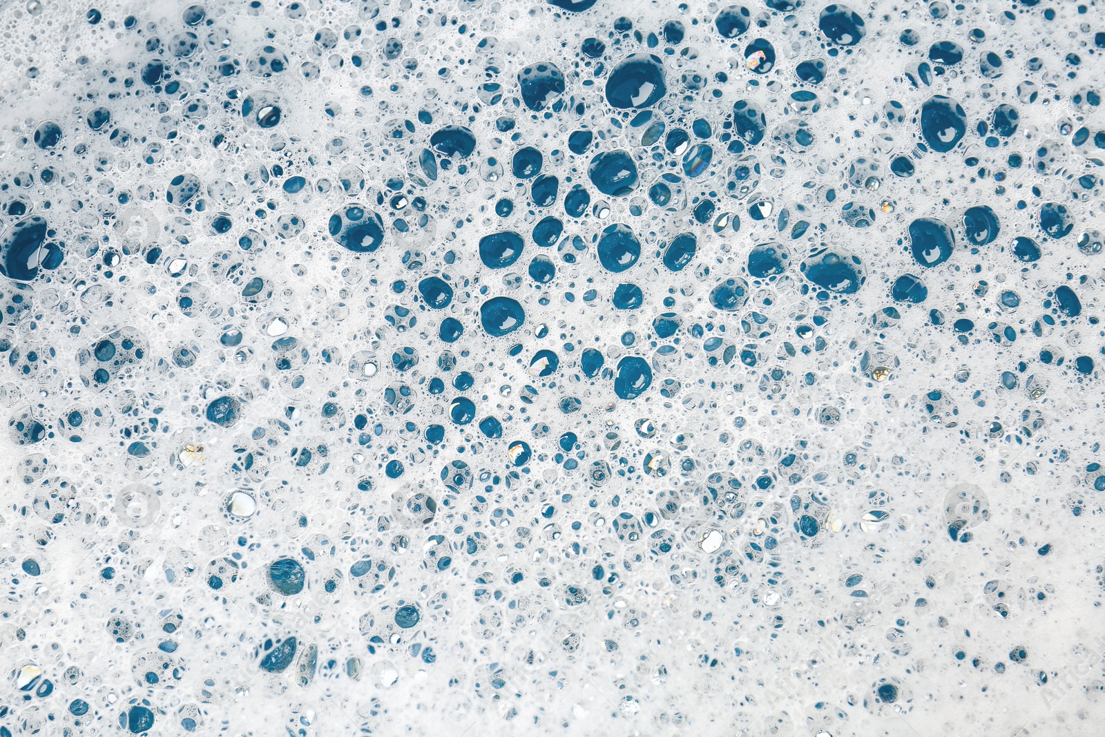 Photo of Detergent foam with bubbles as background, top view